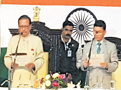 Arunachal Governor J P Rajkhowa administers oath of office and secrecy to Chief Minister Kalikho Pul at the Raj Bhawan.  Ranju Dodum