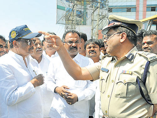 Bengaluru Development Minister K J George (2nd from left) with Additional Commissioner of Police (Traffic) M A Saleem during the inspection at KR Puram junction on Friday. DH PHOTO
