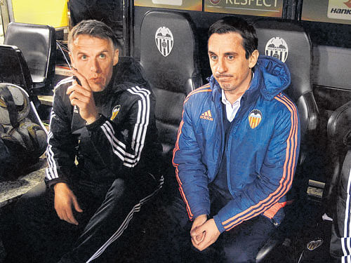 in the hot seat: Manchester United great Gary Neville (right) has endured a torrid start to his coaching career at Valencia. reuters