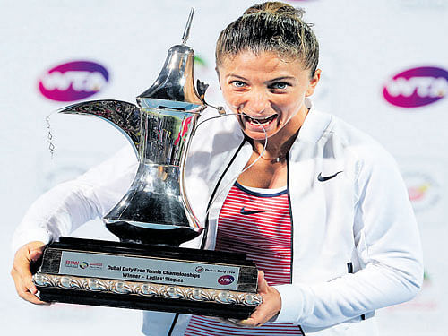 ECSTATIC Sara Errani of Italy poses with her Dubai Open      trophy on Saturday. Reuters