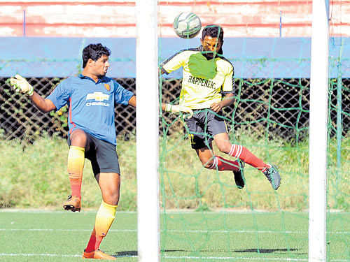 so close:  SAI's Raj Kiran (right)&#8200;attempts to score past RWF goalkeeper Arun during their  Super Division clash at the Bangalore Football Stadium on Monday. Dh photo