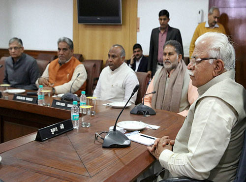 Haryana Chief Minister Manohar Lal Khattar presiding over a Cabinet meeting regarding Jat reservation in Chandigarh on Monday. PTI Photo