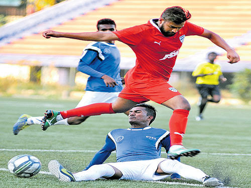 ON THE MOVE Yatish of DYES (on the ground) checks Vishal Kumar of BFC during their Super Division match. DH PHOTO
