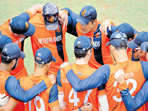 GEared up The Dutch cricket team in a huddle at the Alur grounds where they kicked off a training camp for the World T20. DH photo/ srikanta sharma r
