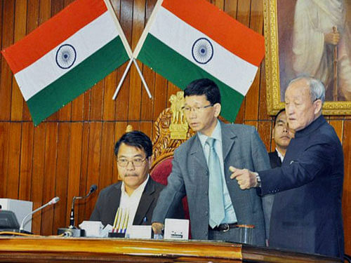 Newly appointed Speaker of Arunachal Pradesh Assembly Wangki Lowang being escorted by Chief Minister Kalikho Pul to the chair at Itanagr on Thursday. PTI Photo.