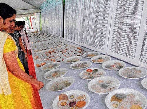 Visitors take a look at an array of dishes on display at the Global Wellness Meet 2016 in Bengaluru on Friday. DH Photo