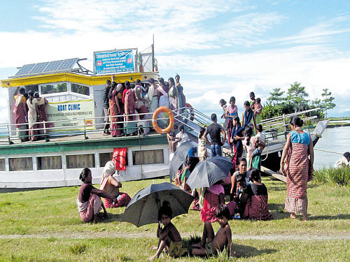 One of the boat clinics and patients around it .  C SINHA