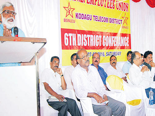 BSNL Employees Union Zonal Secretary C K Gundanna speaks at the sixth district convention of the BSNL Employees union in Madikeri on Saturday. dh photo