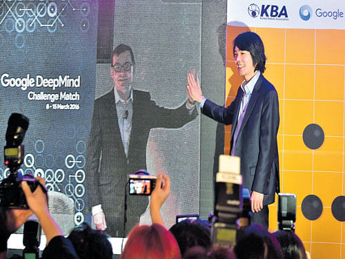 Lee Se-Dol, a legendary South Korean player of Go  - a board game widely played for centuries in East Asia - poses with Google Deepmind head Demis Hassabis (on screen at L) during a joint video conference call on the Google DeepMind Challenge Match at Korea Baduk Association in Seoul. AFP