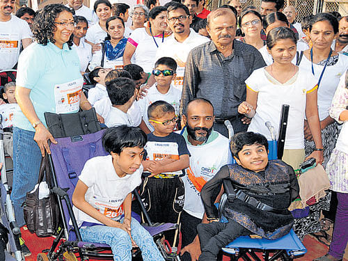 Kannada actor Kishore poses with children suffering from rare diseases at Race for 7, an event organised to address  the challenges faced by such patients and their families at  St Joseph's Indian High School grounds on Sunday. dh photo