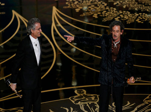 White points to Mangini as they accept the award for Best Sound Editing for 'Mad Max: Fury Road' at the 88th Academy Awards in Hollywood. Reuters photo