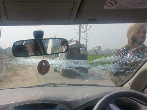 Delhi Chief Minister Arvind Kejriwal's car was today attacked by protesters allegedly belonging to Akali Dal who pelted stones on the vehicle breaking its windshield but the AAP leader escaped unhurt. Image Twitter