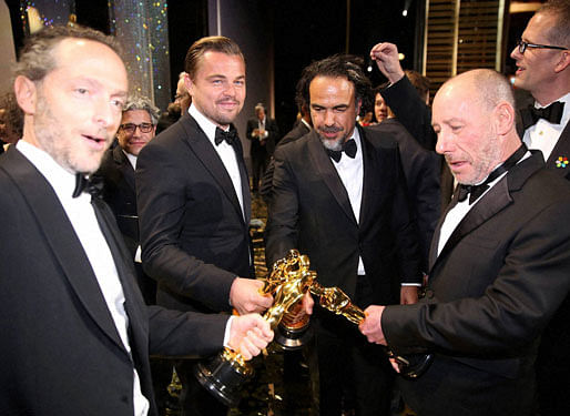 Emmanuel Lubezki, Leonardo DiCaprio, Alejandro G. Inarritu and Chris Jenkins at the Dolby Theatre in Los Angeles.AP/PTI