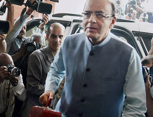 Union Finance Minister Arun Jaitley arrives at Parliament house to present the Union budget 2016-17, in New Delhi on Monday. PTI Photo