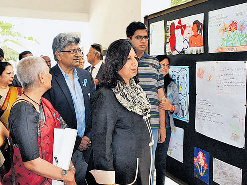 Kiran Mazumdar-Shaw, CMD, Biocon Ltd, and Prof Vijay Chandru, Honorary Director, Centre for Health Ecologies and Technology (CHET), take a look at artworks made by children  suffering from rare diseases. dh photo