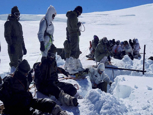 Army personnel carrying out rescue work to recover the body of porter Thukjay Gyasket, who had fallen into a deep crevasse from an old bridge, in Siachen's Northern Glacier on Wednesday. The body was recovered on Wednesday after a massive five-day rescue rescue operation. PTI photo