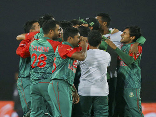 Bangladesh players celebrate after winning the Asia Cup Twenty20 international cricket match against Pakistan in Dhaka on Wednesday. PTI