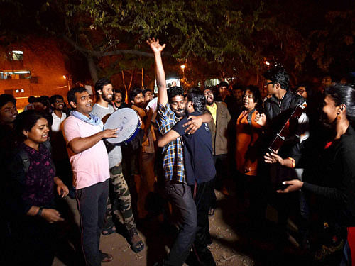 Jawaharlal Nehru University students celebrate after Delhi High Court granted bail to JNUSU president Kanhaiya Kumar at the JNU campus in New Delhi on Wednesday. PTI Photo