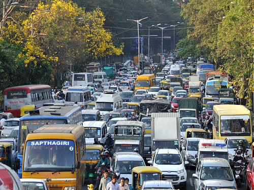 Heavy traffic jam during Farmers protest by rally at Bellary road in Bengaluru on Thursday.  DH photo