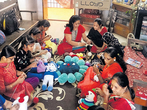 benevolent Asha Patravali (centre) teaches knitting to women in Belagavi.