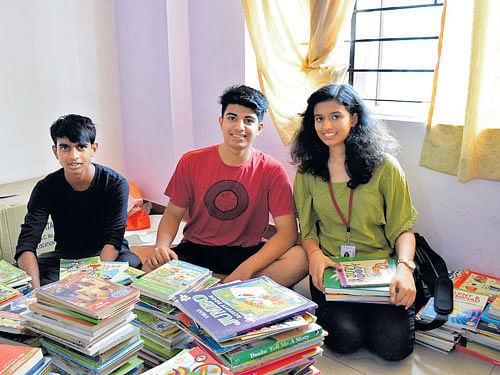 helpful Sudhanshu, Prithvin and Prapti with a collection of books.