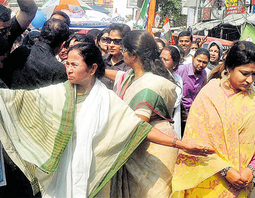 TMC chief and West Bengal Chief Minister Mamata Banerjee leads an election campaign rally for Assembly polls in Kolkata on Tuesday. PTI