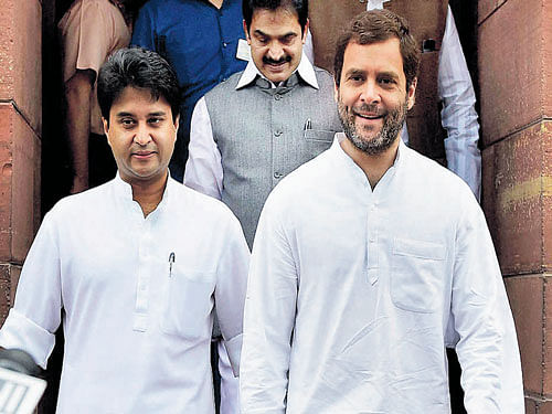 Congress vice-president Rahul Gandhi with party leader  Jyotiraditya Scindia at the Parliament House in New Delhi  on Monday. PTI