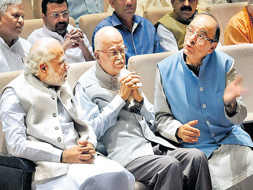 Prime Minister Narendra Modi with senior BJP leader LK  Advani and Finance Minister Arun Jaitley during the BJP  Parliamentary Party meeting in New Delhi on Tuesday. PTI