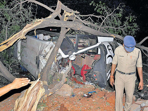 The mangled remains of the bus after the accident at Gollapudi near Vijayawada on late Monday night. PTI