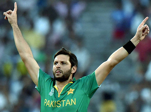 Pakistan's skipper Shahid Afridi celebrates after clinching a wicket during World Cup T20 match against Bangladesh at Eden Gardens in Kolkata on Wedneday. PTI Photo