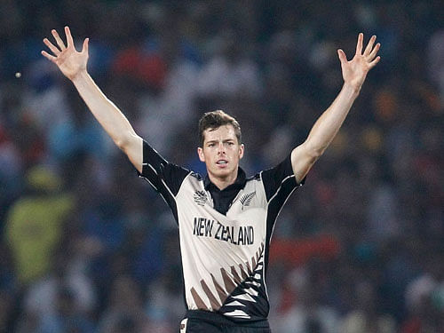 New Zealand's Mitchell Santner celebrates taking the wicket of India's Hardik Pandya. Reuters Photo.