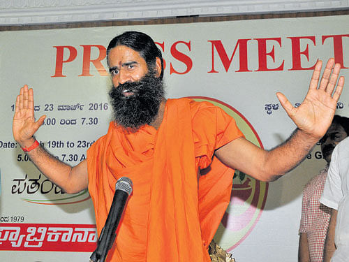 Yoga guru Baba Ramdev addresses a press conference  in Bengaluru on Friday. DH photo