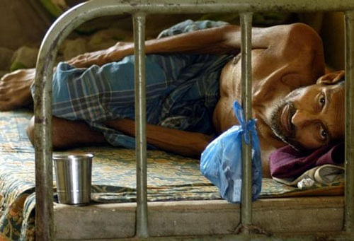A patient suffering from Tuberculosis rests inside a hospital in Agartala, March 24, 2009. Reuters