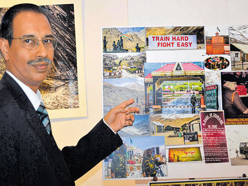 Oncologist Ravi Kumar with his photos.