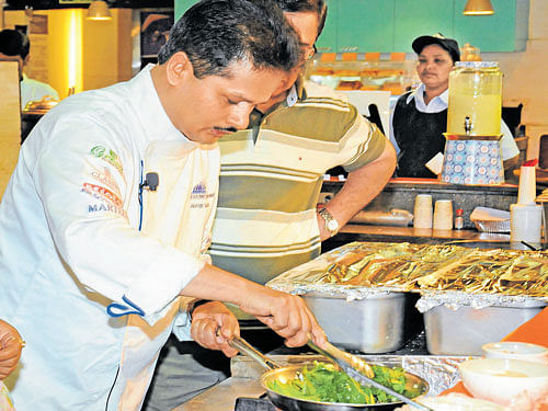 engrossed Chef Abhijit Saha DH PHOTO BY SK DINESH