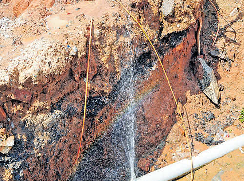 A road has been dug up to fix this broken drinking water pipeline in the City. DH FILE PHOTO