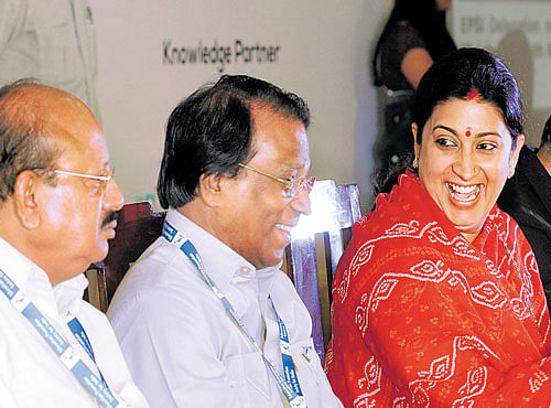 IN CONVERSATION: Higher Education Minister T B Jayachandra and Education Promotion Society for India president G Viswanathan interact with Union Minister for Human Resources Development Smriti Irani in Bengaluru on Tuesday. DH PHOTO