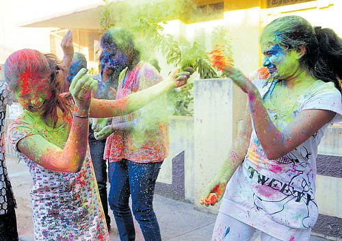 cautious Many people prefer using organic colours when playing 'Holi'.