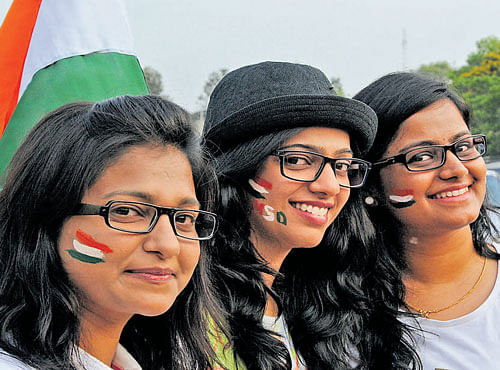 WE'RE LOVING IT Fans sport India colours during the India vs Bangladesh ICC T-20 world cup match in Bengaluru on Wednesday. DH photo