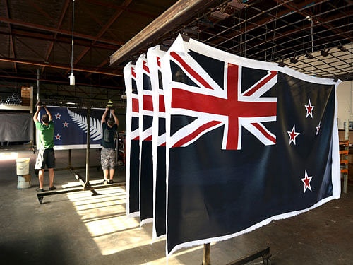 File photo of factory workers hanging new designs of the national flag of New Zealand at a factory in Auckland, New Zealand. New Zealand today voted in favour of retaining the country's flag, the preliminary results of a referendum showed. Reuters