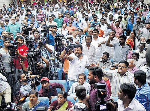 The man (centre), who threw a shoe at Kanhaiya Kumar, shouts during a seminar on constitutional rights in Hyderabad on Thursday. PTI