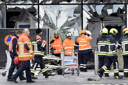 Broken windows of the terminal at Brussels national airport are seen during a ceremony following bomb attacks in Brussels metro and Belgium's National airport of Zaventem, Belgium, March 23, 2016. Reuters