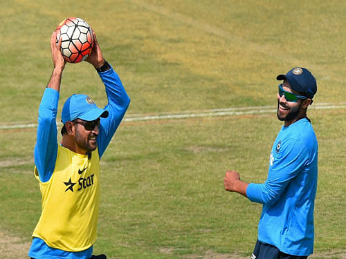 India's M S Dhoni and R Jadeja during a training session in Mohali on Saturday. PTI Photo