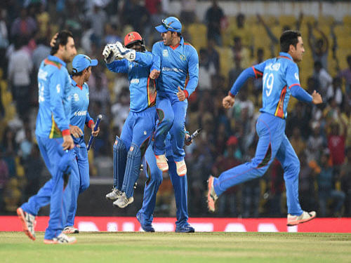 Afghanistan players celebrate their victory against West Indies during the ICC T20 World cup match played in Nagpur on Sunday. PTI Photo.