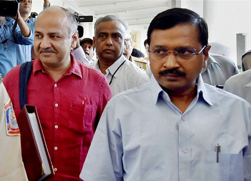 Delhi CM Arvind Kejriwal with Dy CM and Finance Minister Manish Sisodia leave for the budget session of the Assembly, in New Delhi on Monday. PTI Photo