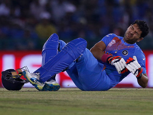 India's Yuvraj Singh grimaces in pain. REUTERS File Photo