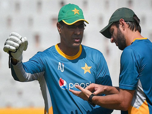 Pakistan captain Shahid Afridi with coach Waqar Younis during a training session. PTI File Photo.