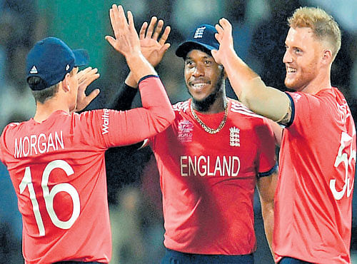 BACKING UP HIS WORDS: England's Ben Stokes (right) celebrates with team-mates the dismissal of a New Zealand batsman. PTI