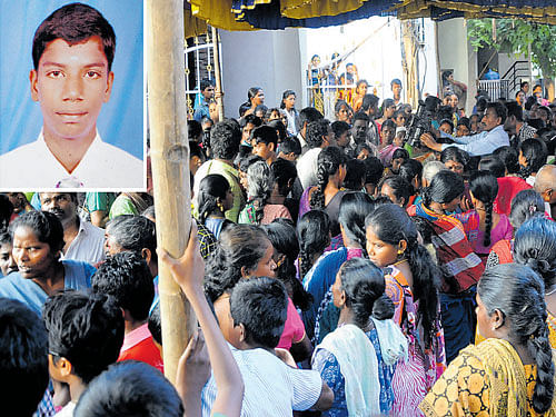tragic: People gather at the residence of Parthiban (inset),  a student of Indiranagar Cambridge school, who committed suicide, at Anandapura in the City on Wedcnesday. Dh Photo