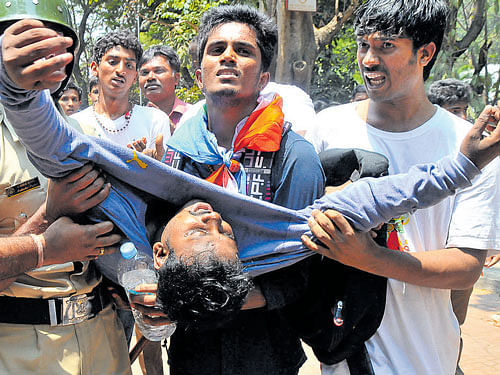 A student who fainted during the protest is being taken to hospital. DH&#8200;PHOTOS